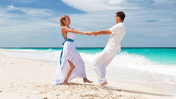 Loving wedding couple on beach